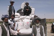 North-west Afghanistan. Villagers from Bashlamist prepare to leave the distribution site with their supplies.