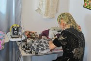 Kyrgyzstan. A woman uses the sewing machine she has bought with funds supplied via an ICRC Micro-Economic Initiative.