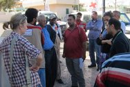 Libyan Red Crescent Society clinic, Sirte, Libya. ICRC and volunteers from the Sirte and Ajdabiya branches of the LRCS discuss relief needs.