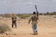 Men carrying weapons in Somalia.