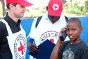 A boy in Port-au-Prince affected by the earthquake uses an ICRC satellite phone to reassure his relatives.