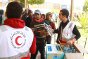 Sallum, border crossing between Libya and Egypt. Volunteers of the Egyptian Red Crescent hand out food rations to thousands of migrants fleeing the armed violence in Libya.