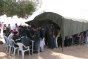 Choucha camp, 7 km from Ras Jedir. People fleeing the internal armed conflict in Libya line up to be registered by Tunisian Red Crescent volunteersand call their families.