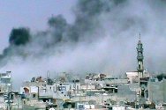 Al Jalidieh, cerca de Homs, Siria. Una columna de humo negro cubre la ciudad en medio de los enfrenamientos.