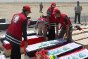 Ponto de passagem de Safwan, província de Basra, Iraque. Equipe do Crescente Vermelho do Iraque prepara caixões que as autoridades do Kuaite entregaram ao Centro Al Zubair do Ministério de Direitos Humanos Iraquiano.