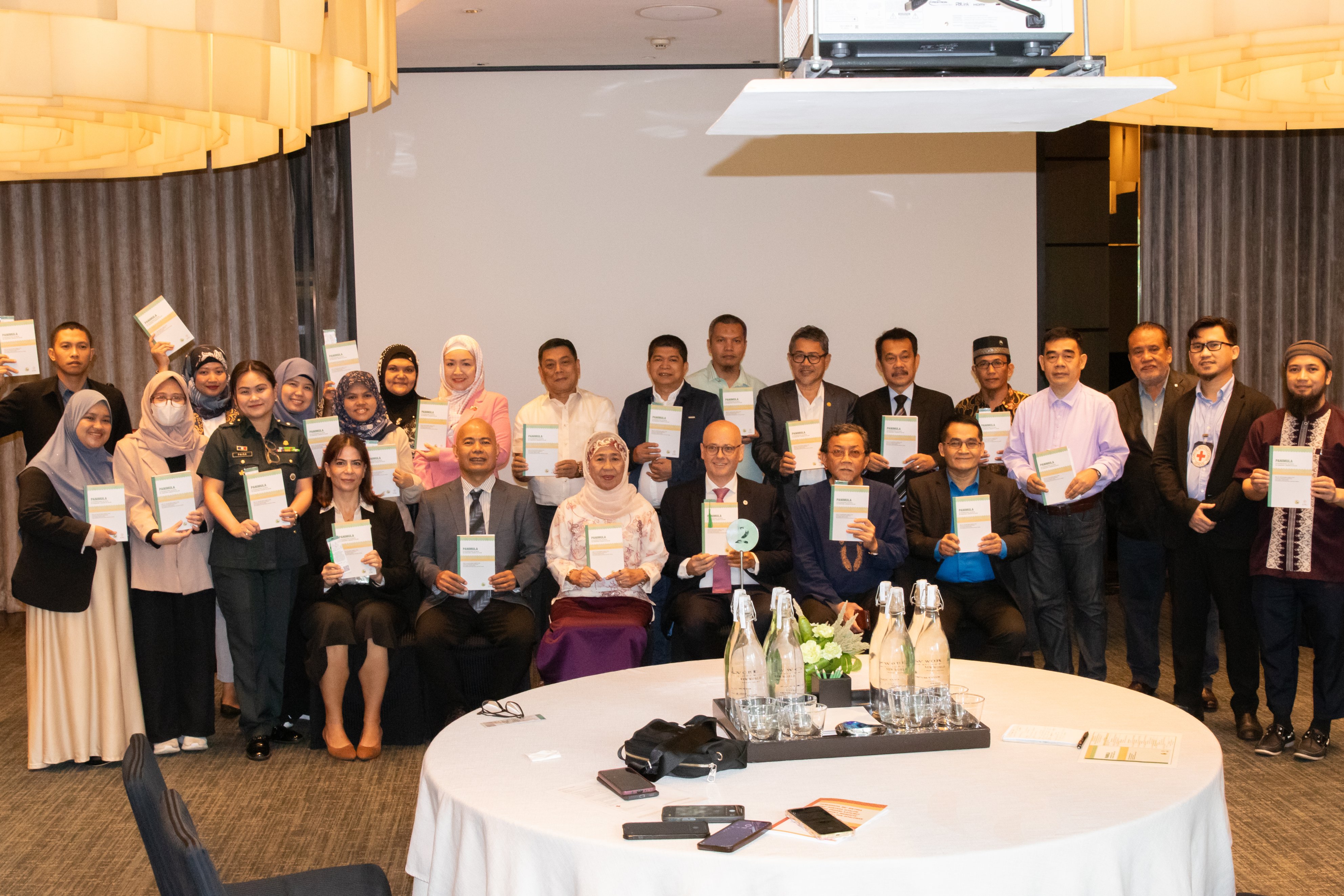 The book launch guests with their own copies of the new publication