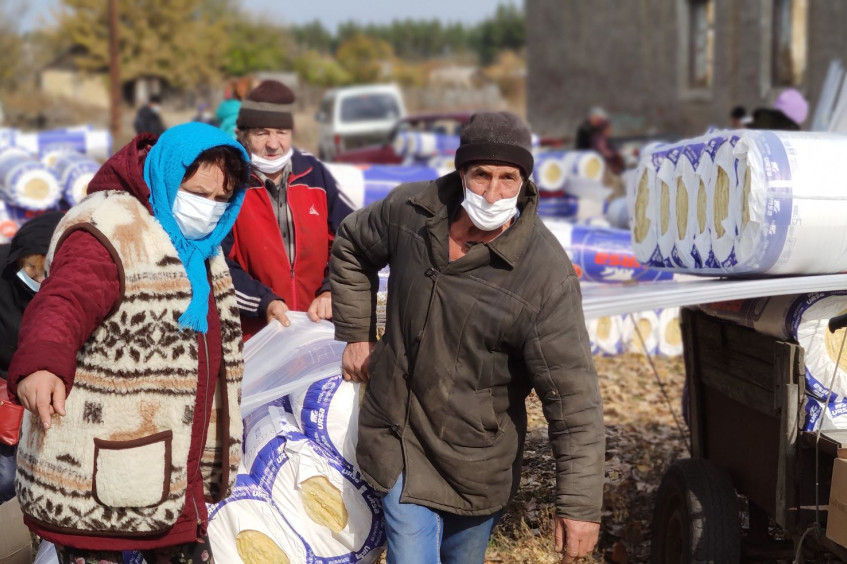 Bringing warmth to settlements on either side of the Donbas conflict