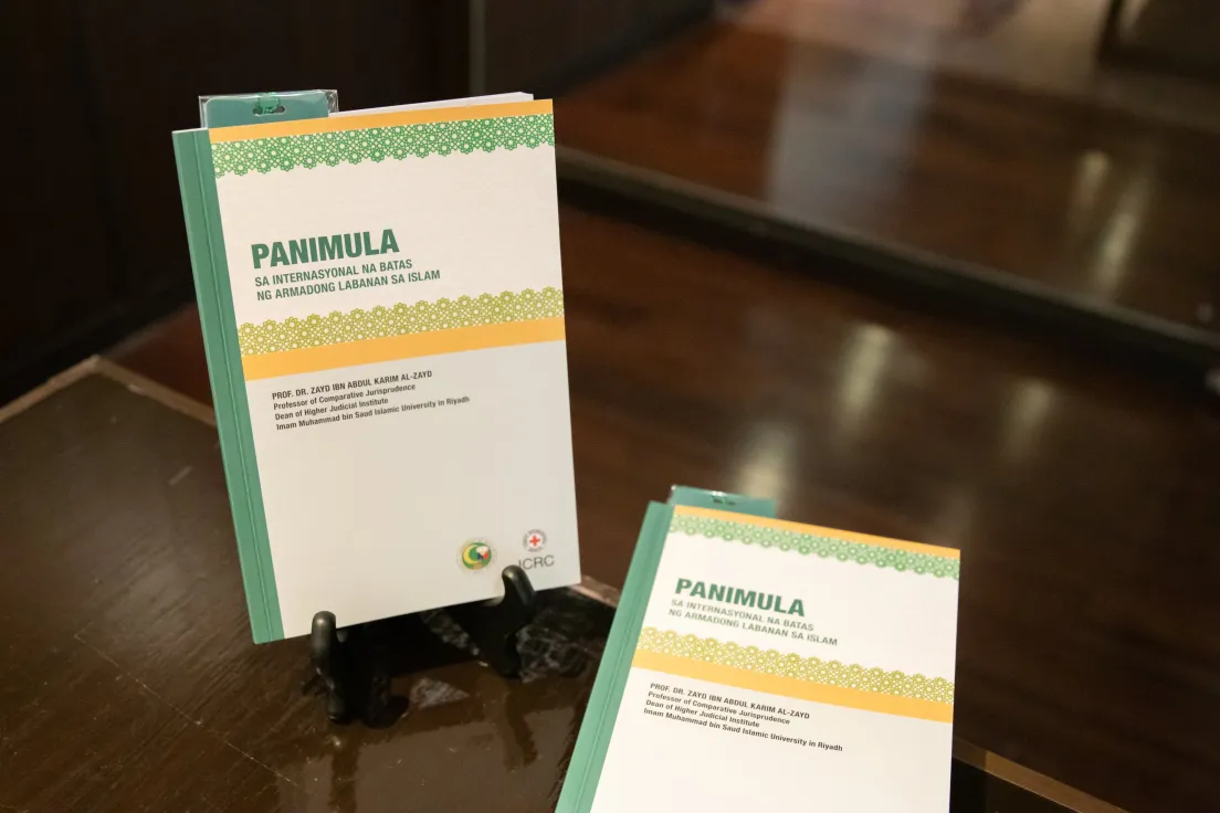 "IHL and Islamic law" book in Tagalog displayed on a desk