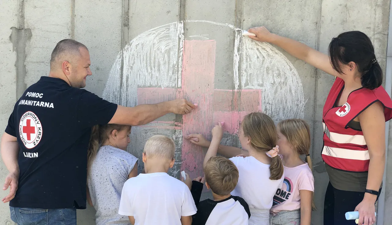 Polish Red Cross Society members with children