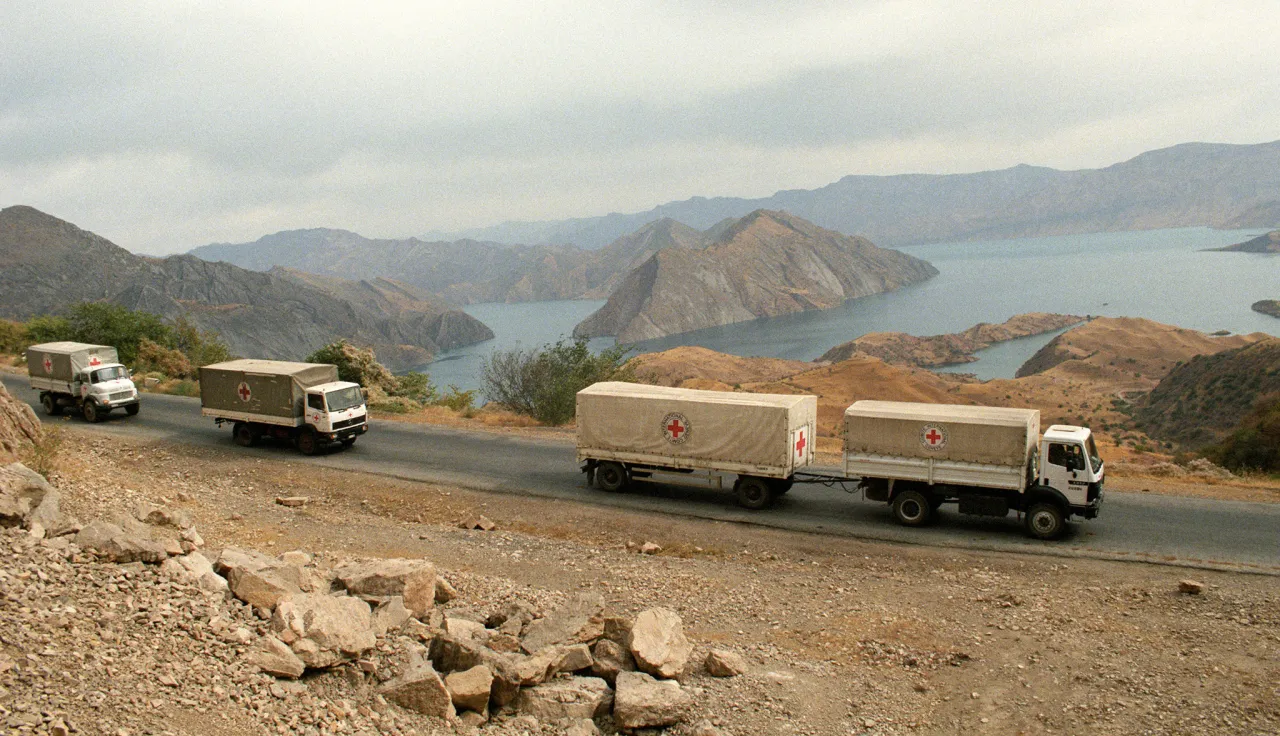 ICRC trucks going down a road.