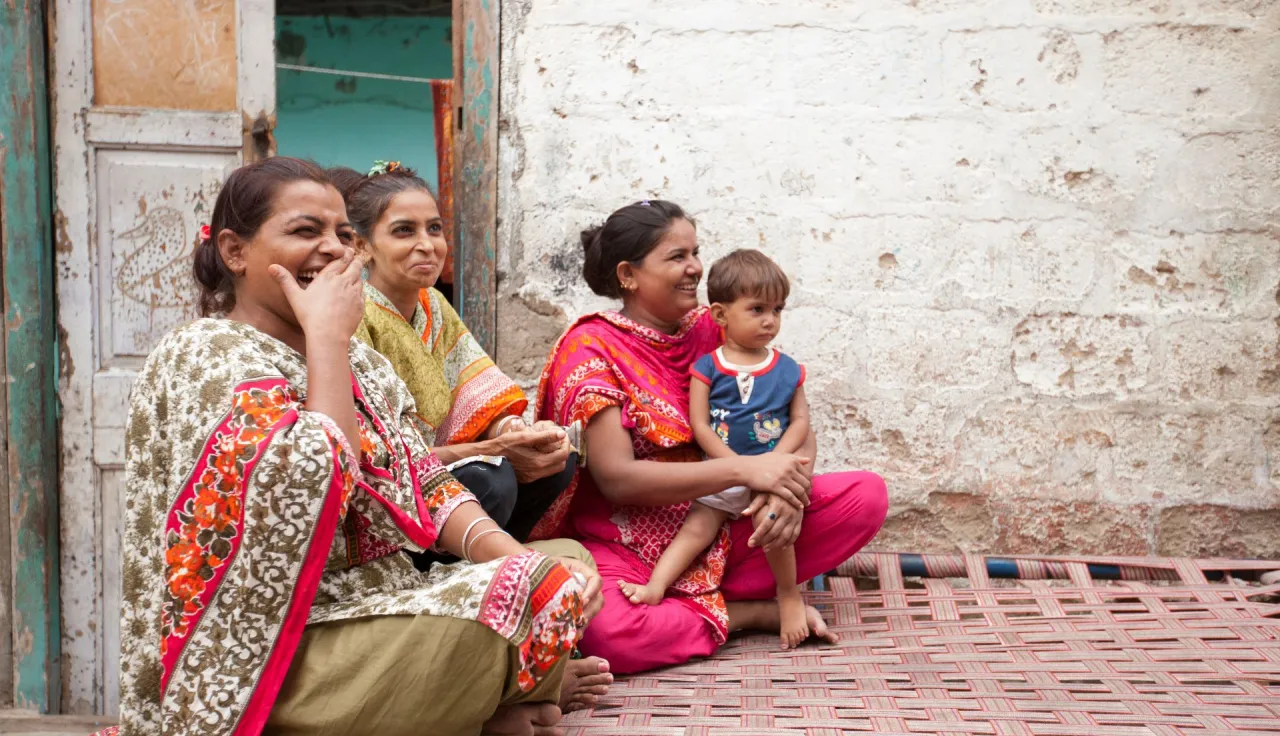 Lyari. Three women from a family of 11 people enjoy a happy moment. They lost everything when they fled their home which they found completely destroyed when they returned. They decided to move to three smaller quarters and rebuild their lives. 