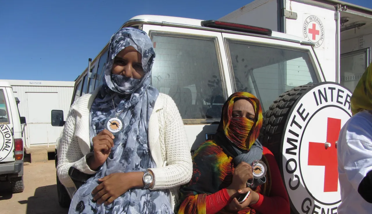 Noukhaila. Habiba (left) and Mariem from the ICRC physical rehabilitation centre show off their medals during the ICRC desert marathon.