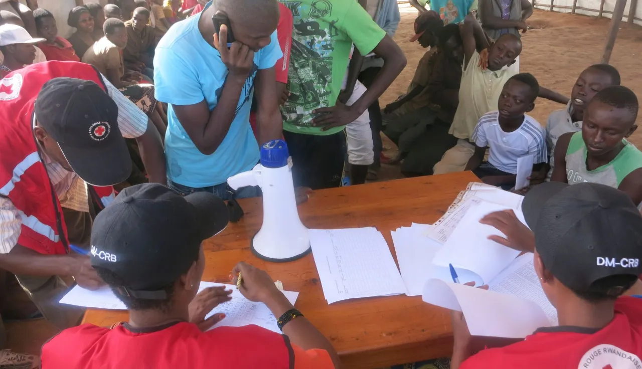 A young Burundian refugee utilizes the free phone call services.