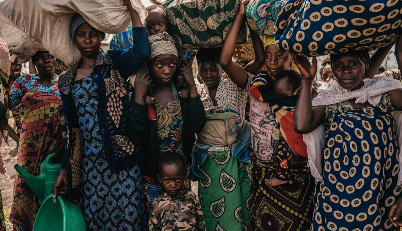 Community members flee to the town of Sake. After arriving to safety, displaced families must build shelter and search for food.