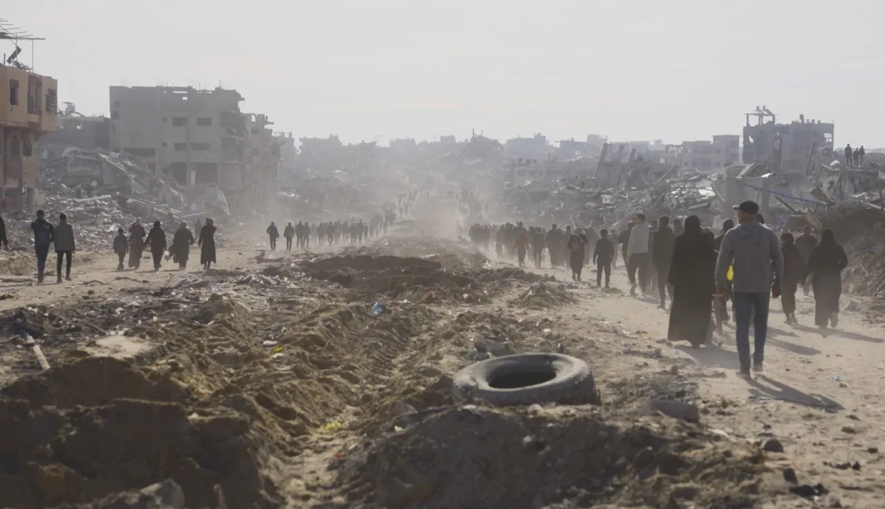 People walking along a dusty road