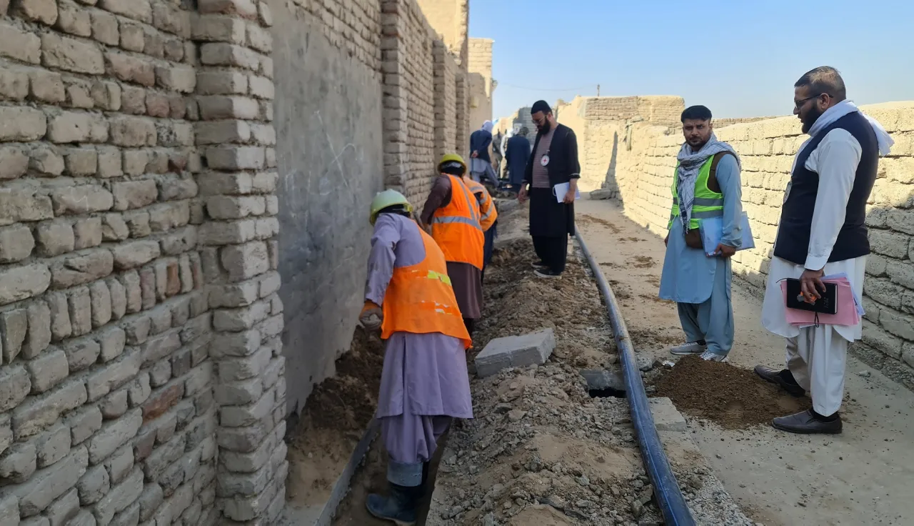 Construction workers in Kandahar City’s District 7 are working on a water supply project