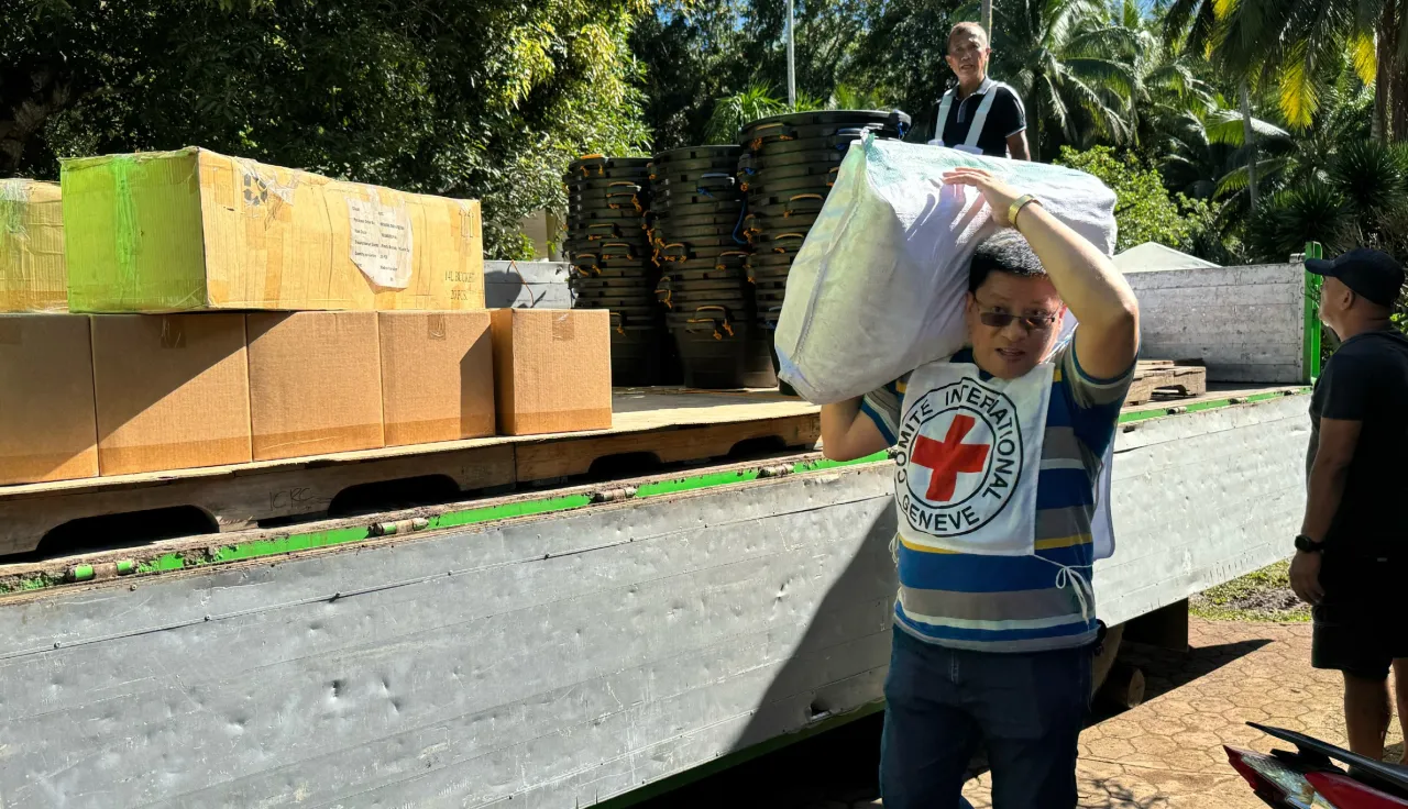 ICRC staff unloading essential household items at Sumisip, Basilan Philippines