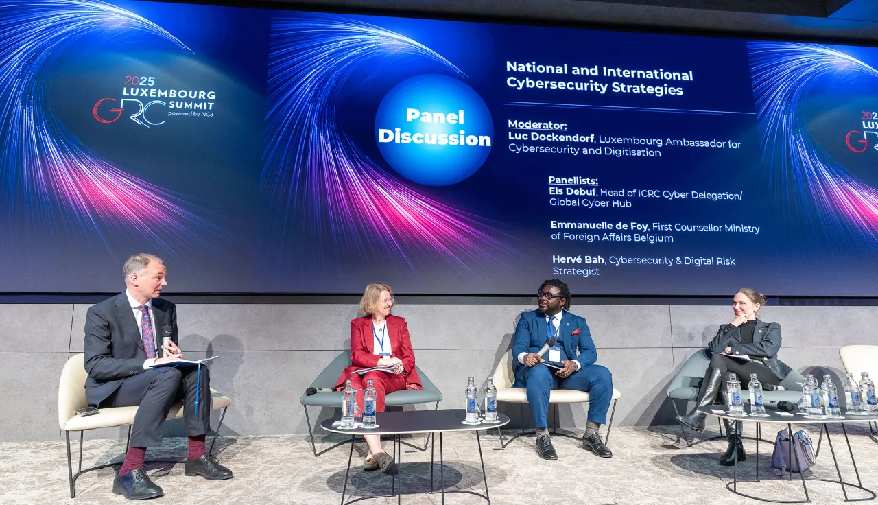 four people sitting on a panel