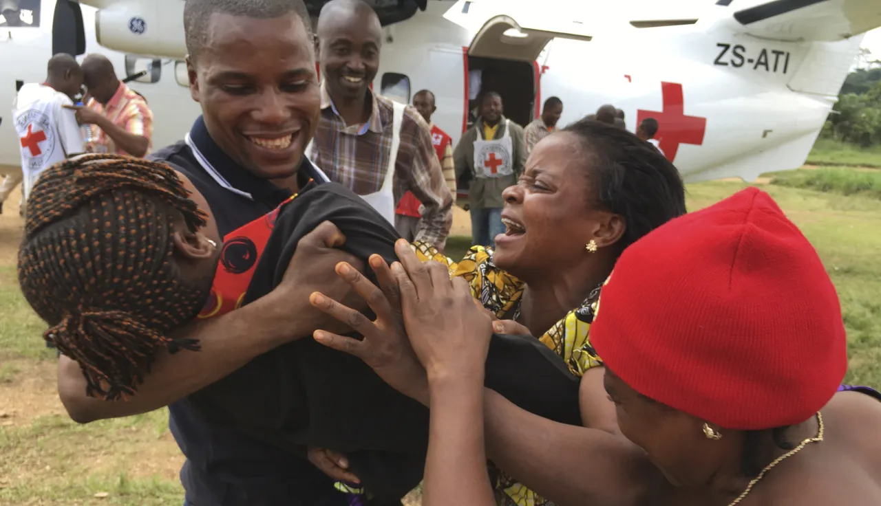 South-Kivu, North-East Shabunda, Tchonka airfield. A girl is reunited with her parents by the ICRC, after 6 years of separation.
