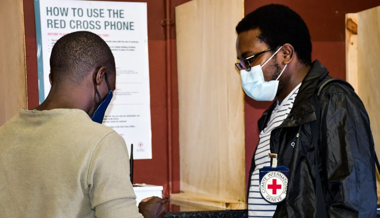 Red Cross delegate with a beneficiary