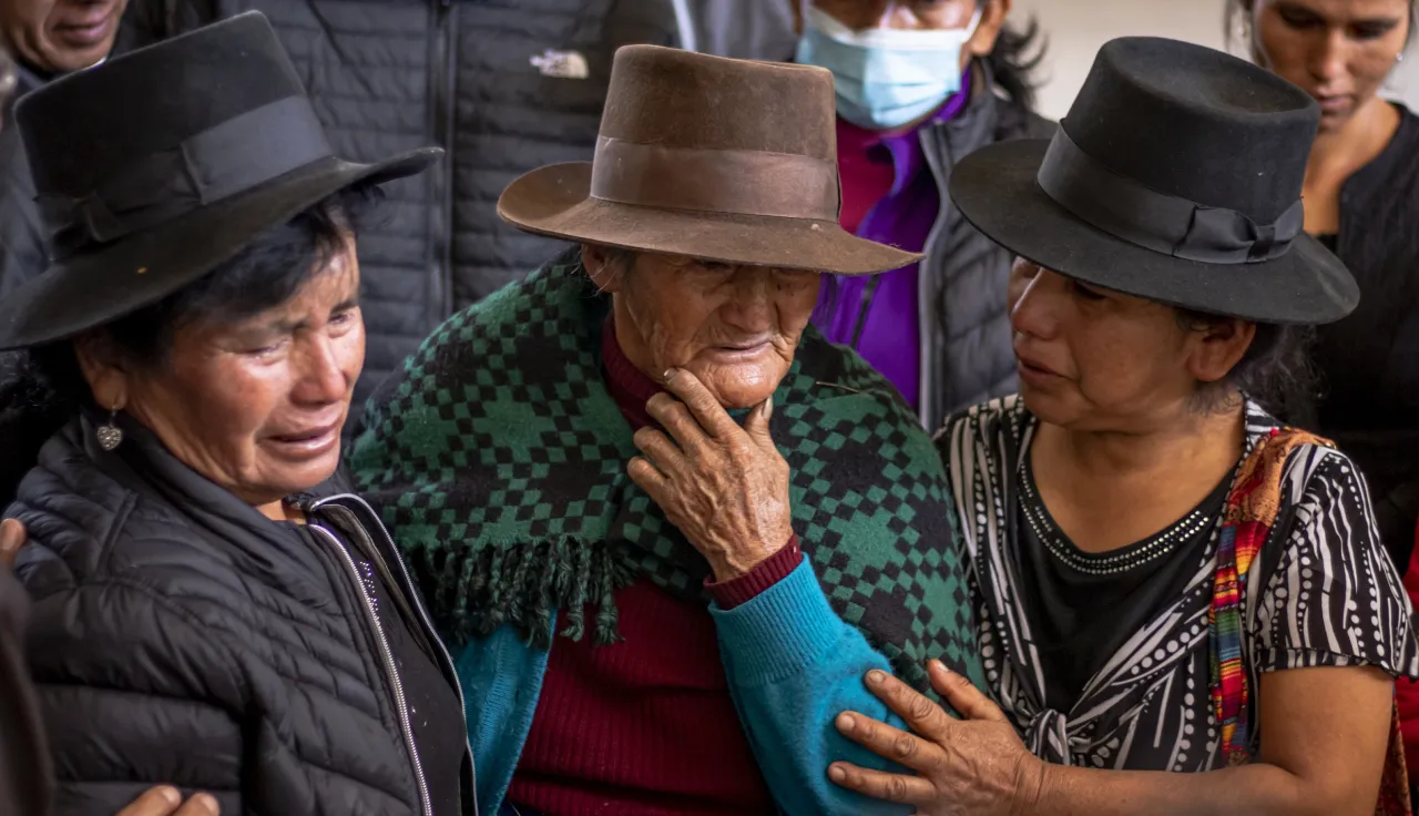 Three women whose family members are missing.