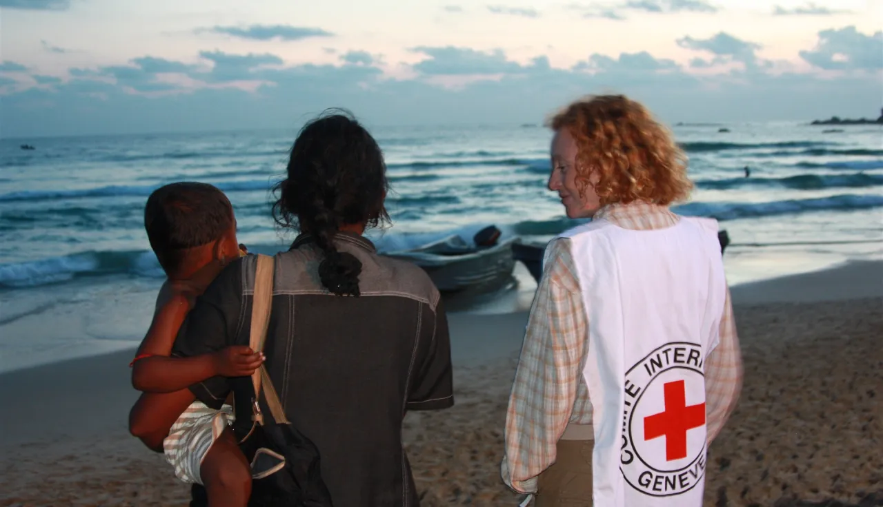 A woman evacuated from the war zone awaits her husband's arrival in Trincomalee, Sri Lanka.