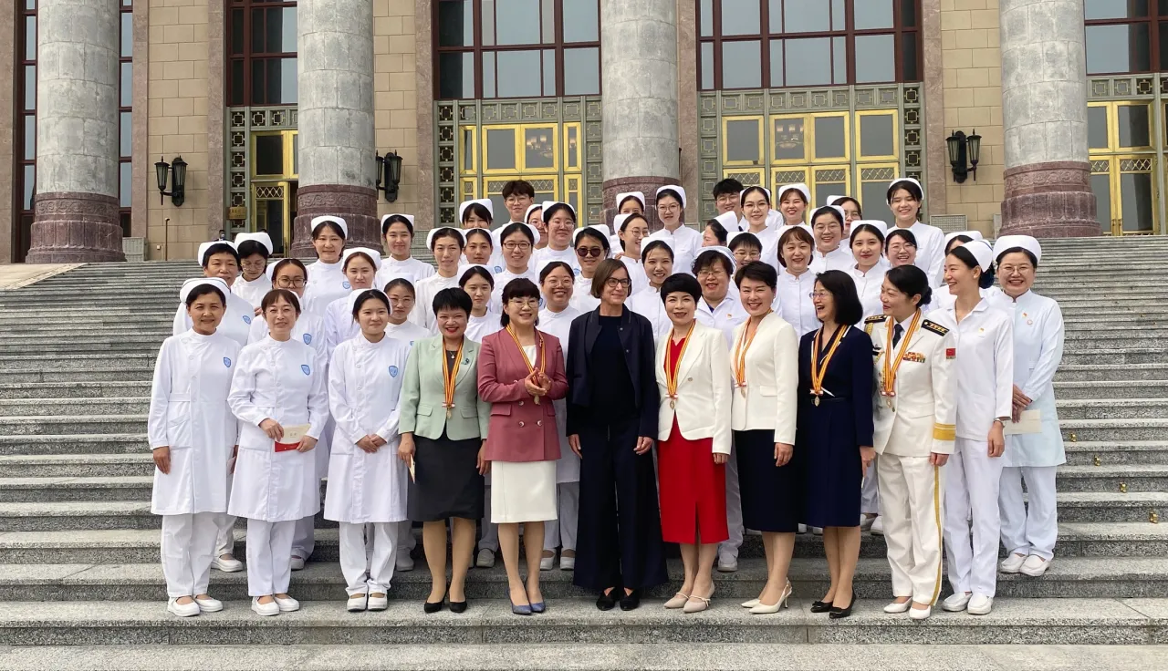 Mirjana Spoljaric, ICRC President, in front of the Great Hall of the People with the Chinese nurses who were awarded 2023 Florence Nightingale Medals. 5 September 2024.