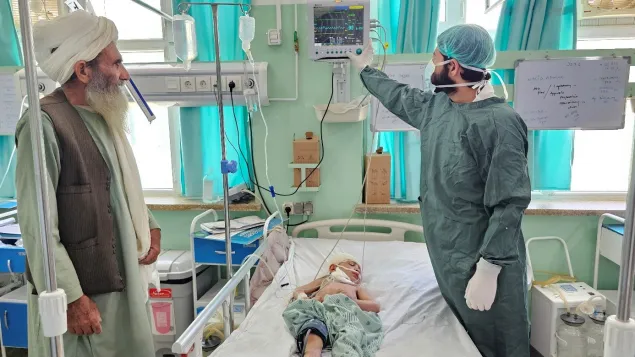 A doctor at the Mirwais Regional Hospital’s Intensive Care Unit (ICU) ward checks the patient monitoring machine