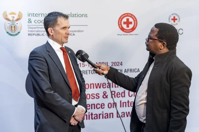 Dr. Niles Melzer, being interviewed at the Conference