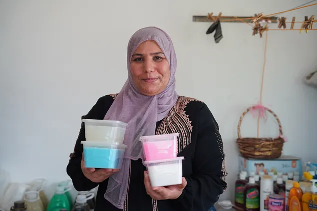 Rosa with tubs of her homemade goods