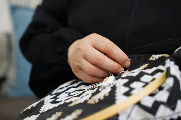 Ratiba's hand as she sews