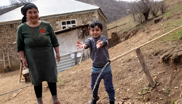 People enjoying a village's newly enhanced water system