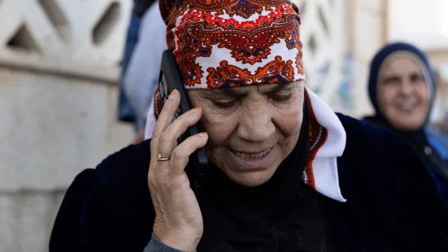 Zakieh talking on the phone with her son in Lebanon