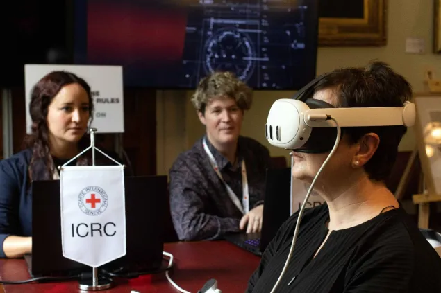 A lady uses a virtual reality headset
