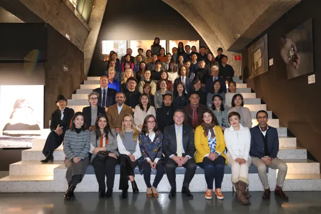 Group photo of participants at the opening ceremony of the Dialogues on Humanity exhibition in Beijing, China.