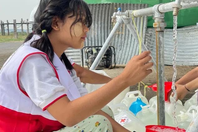 An ICRC worker improving the clean water supply in Myanmar