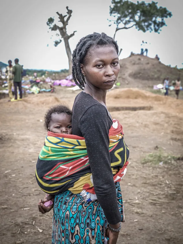 Daniela Mapendo Santana, a refugee from DRC, with her child. Daniela was separated from her family while fleeing violence in DRC. 