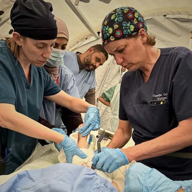 Rieke Hayes treating a patient at the Red Cross Field Hospital.