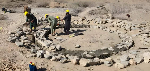 Community workers during cleaning of a Kariz (underground canal) in Nawzad district of Helmand province.