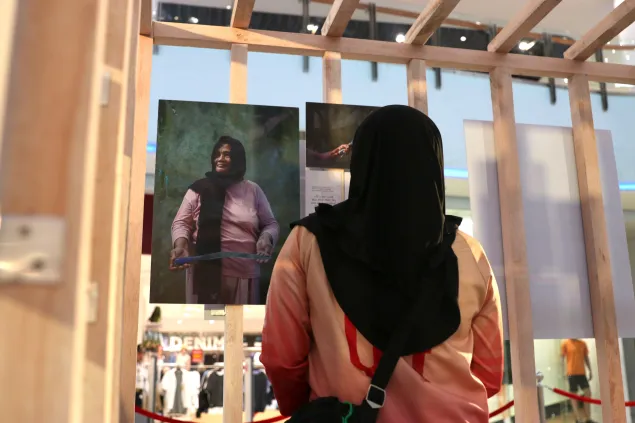 A relative of a missing person viewing the exhibit
