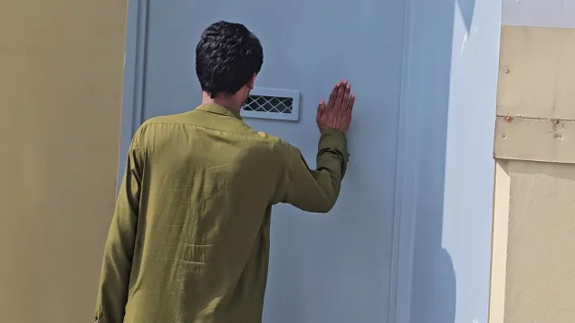 Nader knocks on the gate of the ICRC’s office in Jalalabad city, Nangarhar Province