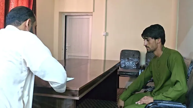 Nader [right] with an ICRC staff member at the ICRC’s office in Jalalabad, Nangarhar Province