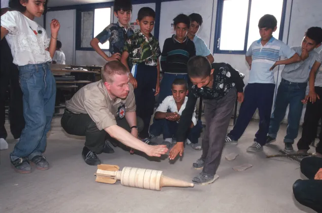 Barda. Showing schoolchildren the dangers of anti-personnel landmines. 