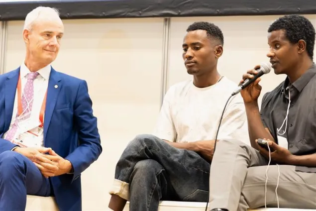 In August 2025, Tesfay shared his touching story at the Tokyo International Conference on African Development, in Yokohama. On his left is the ICRC’s Vice-President, Gilles Carbonnier, and speaking on his right, the ICRC Social Inclusion Officer who accompanied him from Ethiopia, Tilahun Bedada.