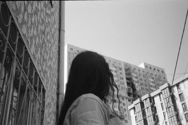 Viktoriia and the damage to her apartment block after a strike in Odesa, Ukraine.