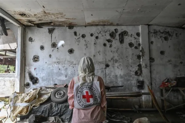 ICRC delegate looks at a bullet-ridden abandoned daycare in Madia, Datu Saudi Ampatuan, Maguindanao del Sur 