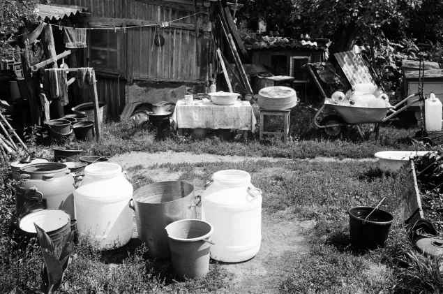 Containers to collect rainwater outside Valentyna's house.