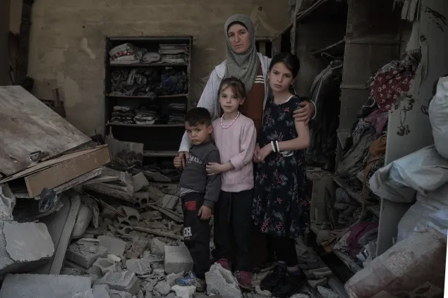 Family in home destroyed by missile attack in Akkar, on the southern border of Lebanon.