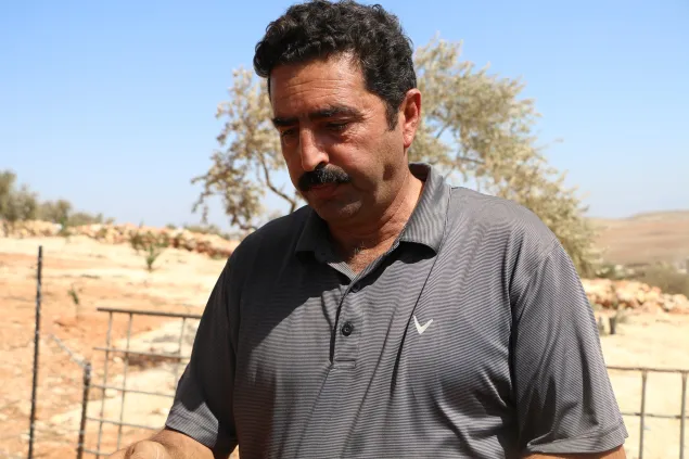 Akram Na’asan (Kamal) used to run the Mughayyir’s only oil press is unable to sustain it after the village lost most of its olive trees.