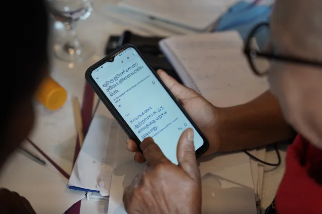 Two family members from the North and the South of Sri Lanka are seen using technology to communicate with each other at the 4th International Conference for Families of Missing Persons, hosted by ICRC delegations and Red Cross and Red Crescent Societies around the world (November 2025)